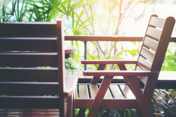 istock Empty Wooden brown chairs on the balcony in cafeteria. 972032662