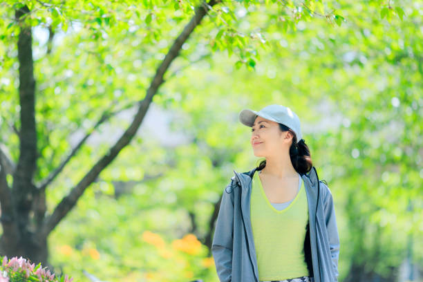 istock Asian women with green blur 972042326