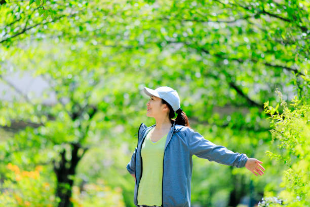 istock Asian women with green blur 972042404