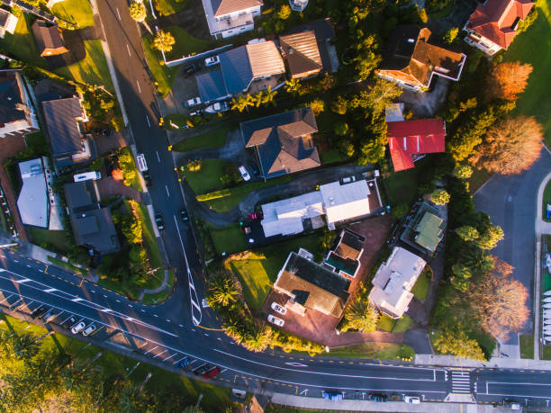 istock Looking down at houses and road cutting through. 972042644