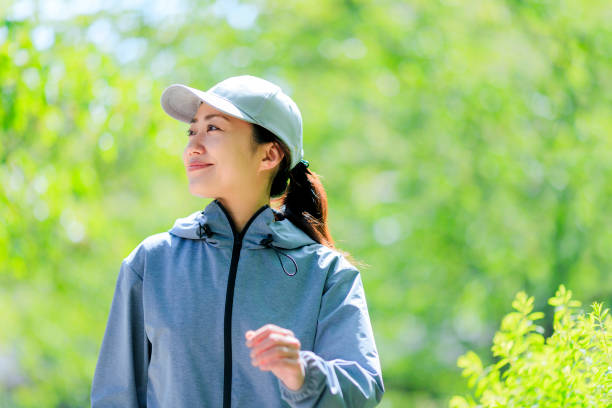 istock Asian women with green blur 972047126