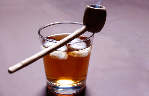 istock A glass of alcohol and a Smoking pipe 972047134
