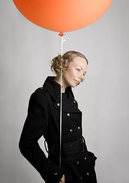 istock Young woman with balloon 97205351