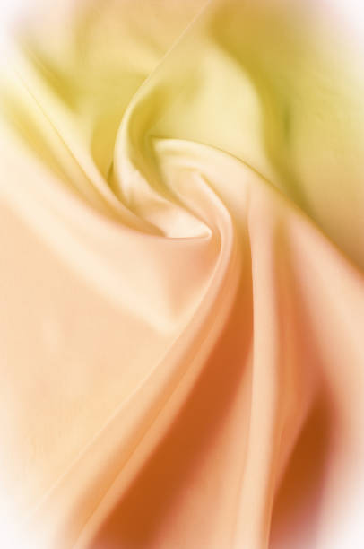 istock Texture background of fabric. Beige fabric. Silk fabric wallpaper texture background pattern in sepia pastel yellow cream beige tint: Lovely natural silk textured textile 972057928