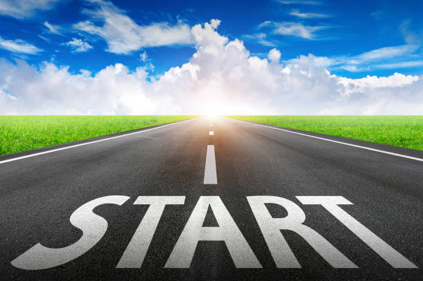 istock Start text on long road. A long straight road and blue sky. 972074046