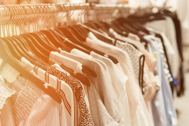 istock Clothes hang on a shelf in a designer clothes store 972074660