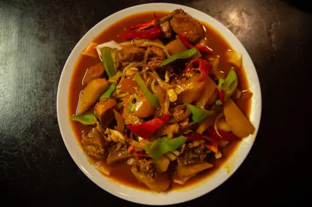 Photo of Uyghur cuisine: handmade noodles fried with chicken and vegetables
