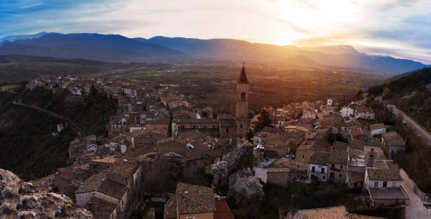istock Small village on the valley at sunset (Pacentro - Italy) 972077606