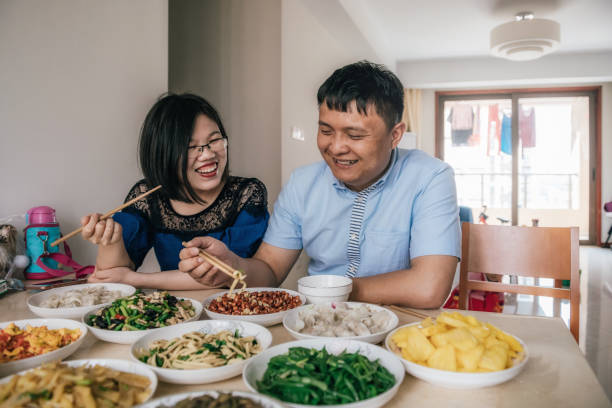 istock chinese couple having lunch together 972089546