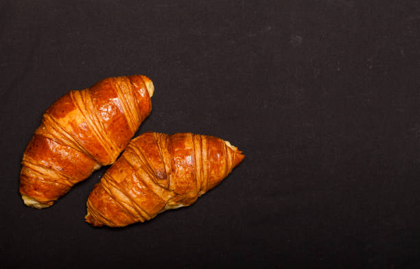 istock Croissants on black background 972098604