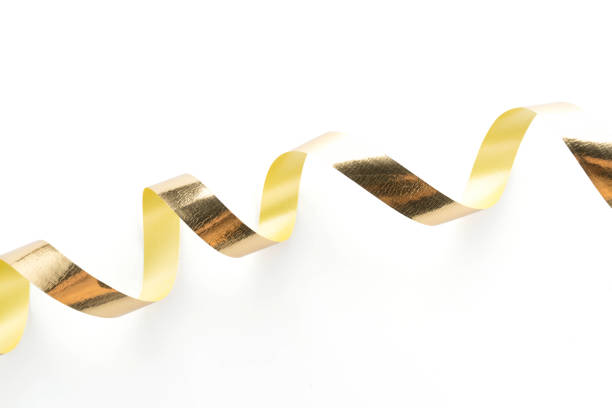 istock Golden ribbon roll isolated on white background 972098894