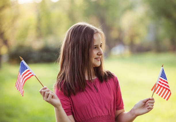 istock Young Girl with an American Flag 972105488