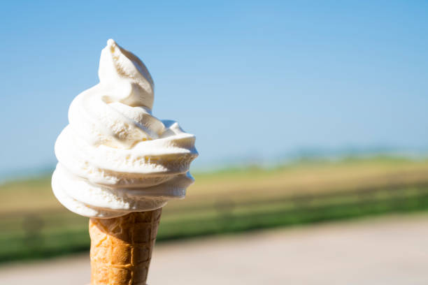 istock close up waffle horn ice cream against blue cloudless sky, space for text 972105600