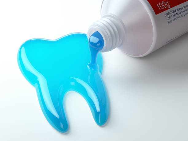 dentifricio a forma di dente che esce dal tubo del dentifricio. lavati i denti concetto dentale. - toothpaste glue blue white foto e immagini stock