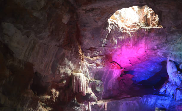 inside view of borra caves formed by solidified stalactites and stalagmites in the karstic limestones formation located in the araku valley of the ananthagiri hill range of the visakhapatnam district in andhra pradesh india captured in dark condition. - solidified imagens e fotografias de stock