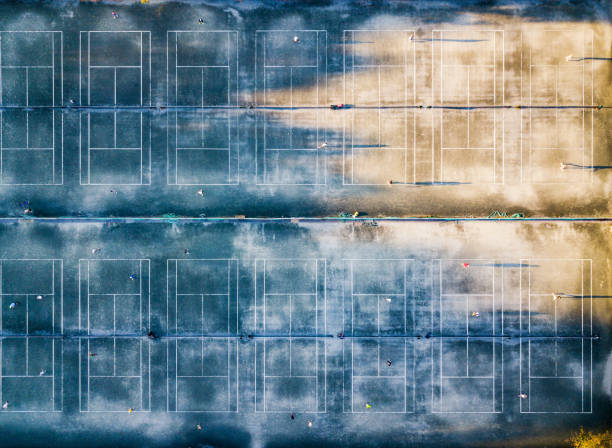 istock Tennis courts aerial view at sunset 972118832