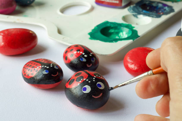 istock homemade  painted stones as ladybugs, creative hobby 972121848