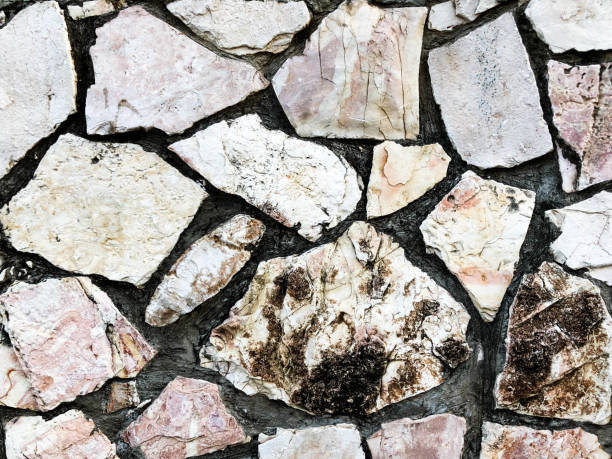 istock Close up of natural stone wall. Stone wall texture 972123976