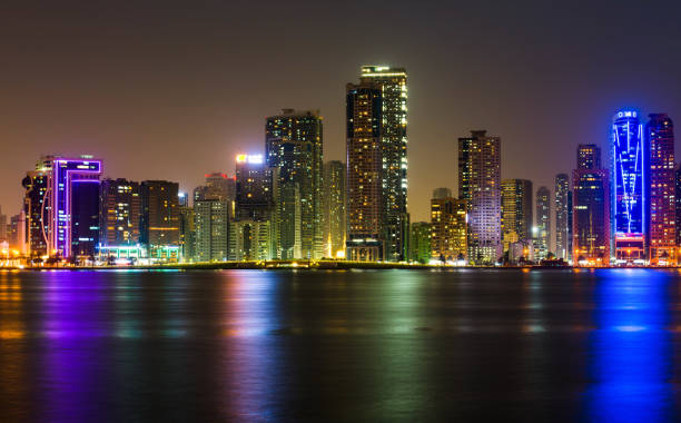 istock Sharjah waterfront cityscape in UAE at night 972131524