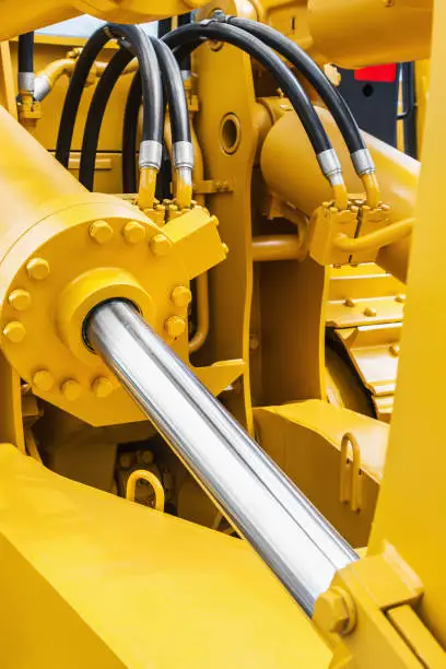pipes and the hydraulic system of the tractor or excavator.Focus on the left side of the frame on the pipes