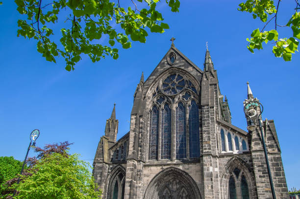 istock High Catholic temple, spire, tower, on sky background 972134508