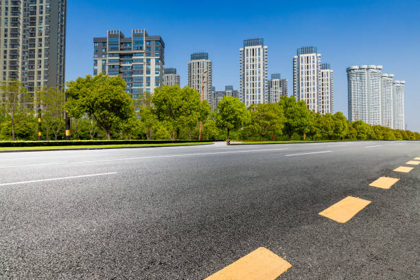 istock Panoramic skyline and modern business office buildings with empty road,empty concrete square floor 972137504