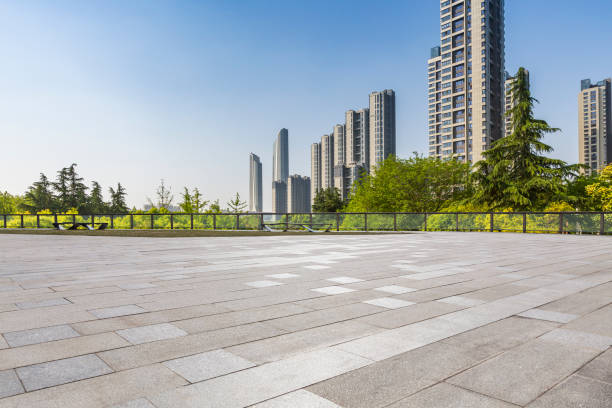 istock Panoramic skyline and modern business office buildings with empty road,empty concrete square floor 972137612