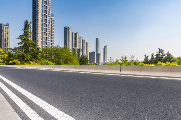 istock Panoramic skyline and modern business office buildings with empty road,empty concrete square floor 972137638
