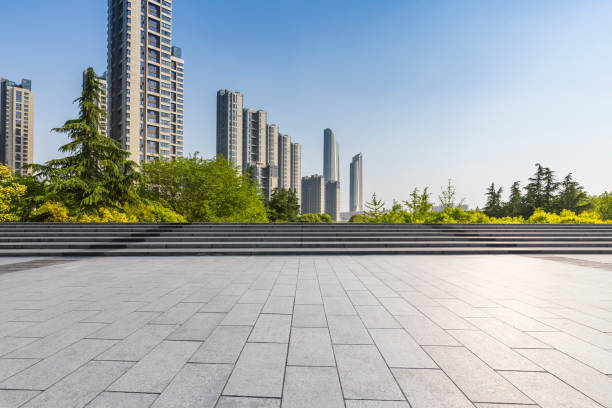 istock Panoramic skyline and modern business office buildings with empty road,empty concrete square floor 972137654