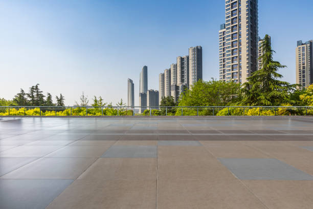 istock Panoramic skyline and modern business office buildings with empty road,empty concrete square floor 972137726