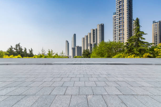 istock Panoramic skyline and modern business office buildings with empty road,empty concrete square floor 972138070