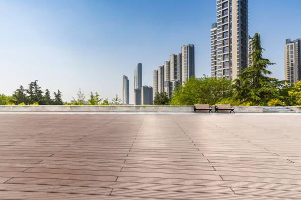 istock Panoramic skyline and modern business office buildings with empty road,empty concrete square floor 972138230