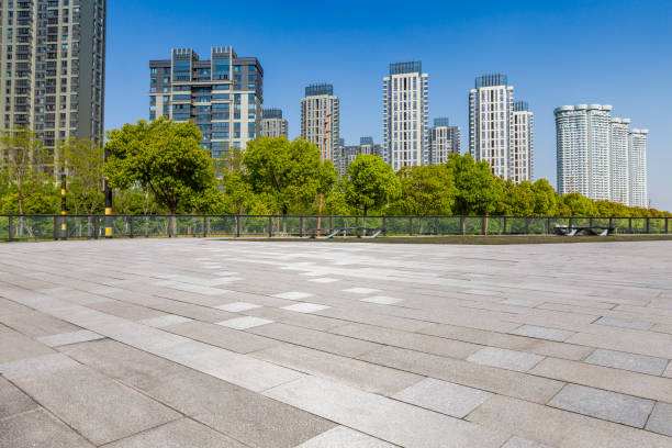 istock Panoramic skyline and modern business office buildings with empty road,empty concrete square floor 972141010