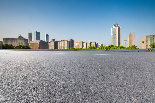 istock Panoramic skyline and modern business office buildings with empty road,empty concrete square floor 972141982