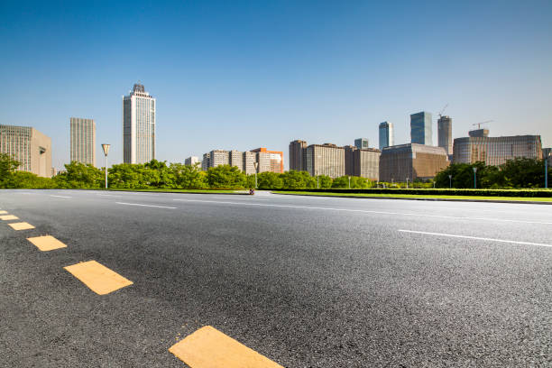 istock Panoramic skyline and modern business office buildings with empty road,empty concrete square floor 972142028