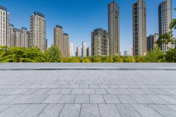 istock Panoramic skyline and modern business office buildings with empty road,empty concrete square floor 972144530