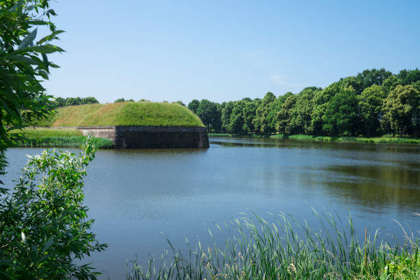 istock fortress wall, reflection in water, Naarden, The Netherlands 972144554