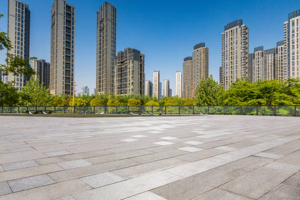 istock Panoramic skyline and modern business office buildings with empty road,empty concrete square floor 972144656