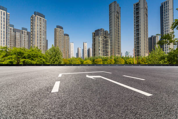 istock Panoramic skyline and modern business office buildings with empty road,empty concrete square floor 972144692