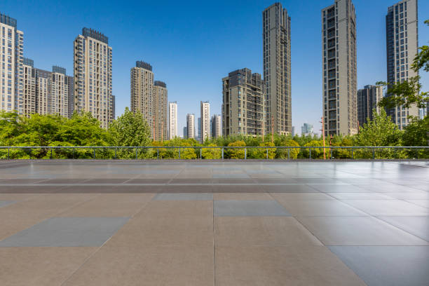 istock Panoramic skyline and modern business office buildings with empty road,empty concrete square floor 972144726