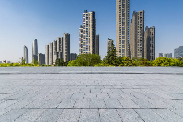 istock Panoramic skyline and modern business office buildings with empty road,empty concrete square floor 972144814
