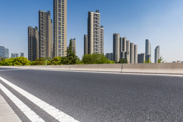 istock Panoramic skyline and modern business office buildings with empty road,empty concrete square floor 972144906