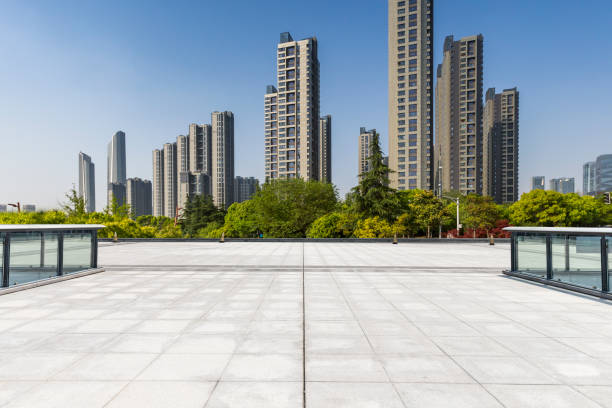 istock Panoramic skyline and modern business office buildings with empty road,empty concrete square floor 972144988