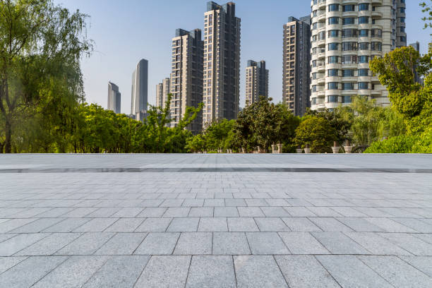 istock Panoramic skyline and modern business office buildings with empty road,empty concrete square floor 972145176