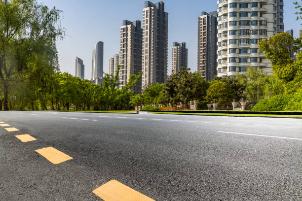 istock Panoramic skyline and modern business office buildings with empty road,empty concrete square floor 972145242