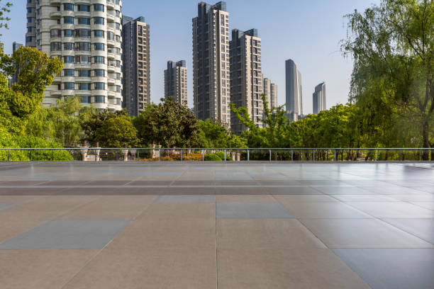 istock Panoramic skyline and modern business office buildings with empty road,empty concrete square floor 972145468