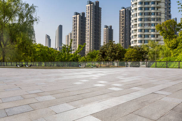 istock Panoramic skyline and modern business office buildings with empty road,empty concrete square floor 972147778