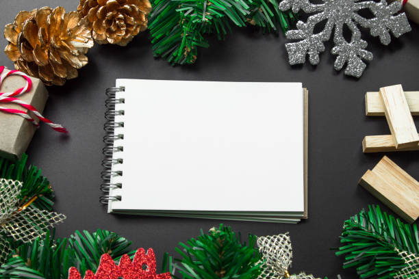istock Christmas background with copy space for product montage or text message. xmas tree on black table 972147920