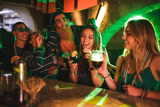 istock Young friends having fun at Saint Patrick's day bar party 972148004