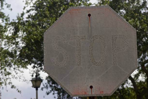 istock old, weathered, sunburned, rusted Stop sign 972148054
